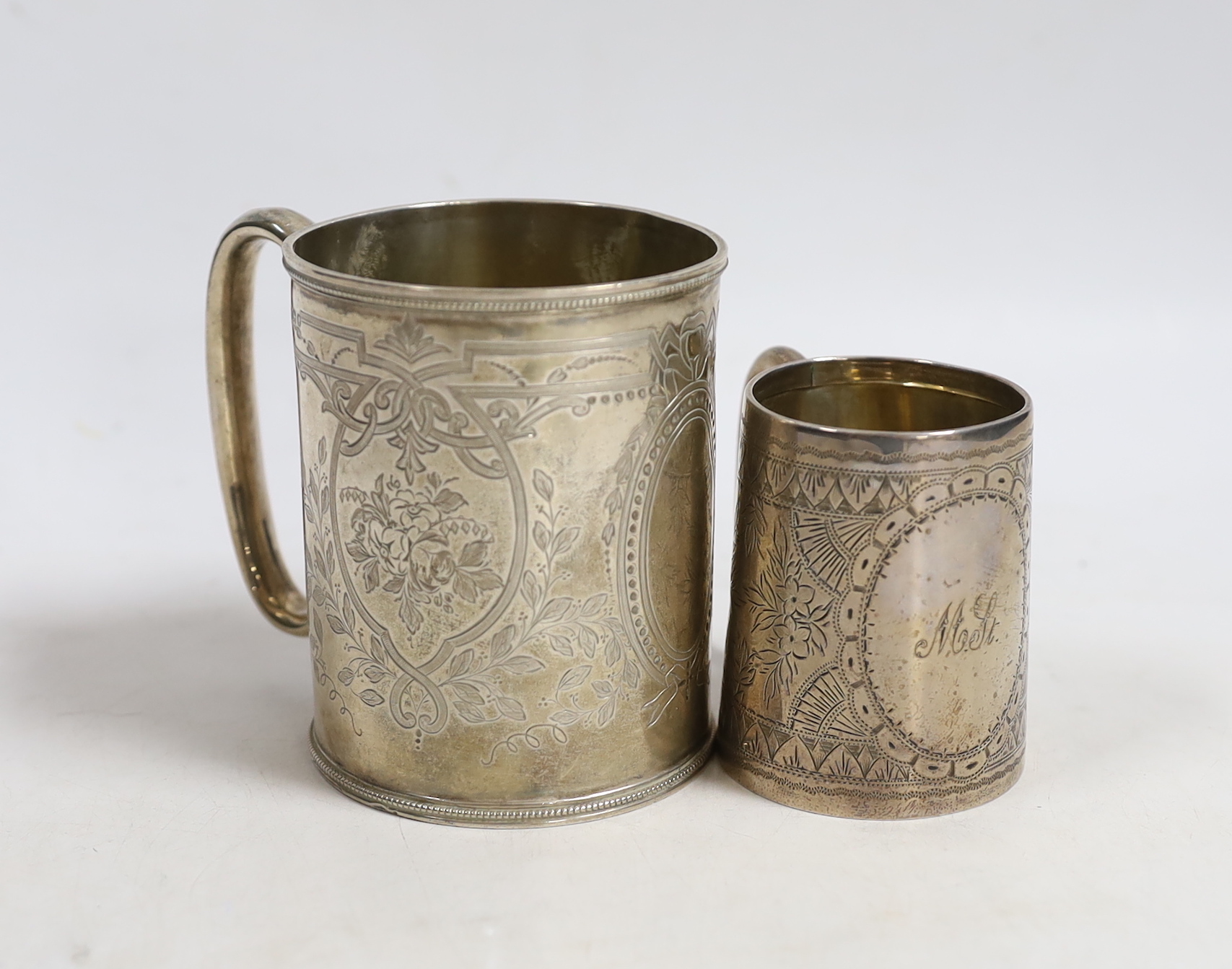 A Victorian engraved silver christening mug, Roberts & Belk, Sheffield, 1873, 87mm, together with another smaller engraved silver mug, Birmingham, 1893.